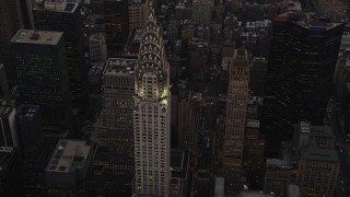 AX89_056 - 4K aerial stock footage Flying by Chrysler Building, Midtown Manhattan, New York, New York, twilight