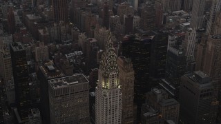 AX89_057 - 4K aerial stock footage Flying by the Chrysler Building, Midtown Manhattan, New York, New York, twilight