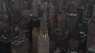 AX89_058 - 4K aerial stock footage Flying by the Chrysler Building, Midtown Manhattan, New York, New York, twilight