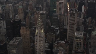 4K aerial stock footage Flying by the Chrysler Building, Midtown Manhattan, New York, New York, twilight Aerial Stock Footage | AX89_059