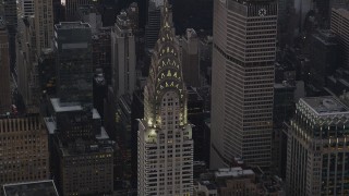 4K aerial stock footage Flying by the Chrysler Building, Midtown Manhattan, New York, New York, twilight Aerial Stock Footage | AX89_060