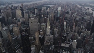 AX89_062 - 4K aerial stock footage Approaching Chrysler Building, Midtown Manhattan, New York, twilight