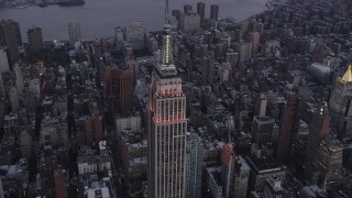 4K aerial stock footage Flying by the Empire State Building, Midtown Manhattan, New York, twilight Aerial Stock Footage | AX89_076