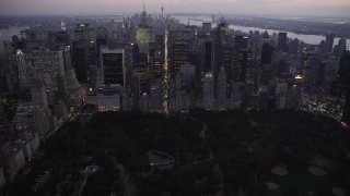 4K aerial stock footage Approaching Central Park, revealing Midtown Manhattan, New York, twilight Aerial Stock Footage | AX89_091