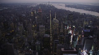 4K aerial stock footage Flying over Midtown Manhattan, approach Empire State Building, New York, twilight Aerial Stock Footage | AX89_095