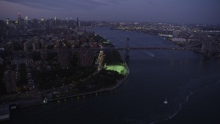 AX89_109 - 4K aerial stock footage Approaching the Williamsburg Bridge, Lower East Side, New York, twilight