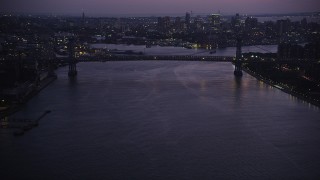 4K aerial stock footage Approaching the Williamsburg Bridge, East River, New York, New York, twilight Aerial Stock Footage | AX89_116