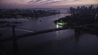 4K aerial stock footage Flying by Williamsburg Bridge, tilt down, New York, New York, twilight Aerial Stock Footage | AX89_118