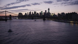 4K aerial stock footage Flying over East River, Lower Manhattan, Manhattan Bridge, New York, twilight Aerial Stock Footage | AX89_120