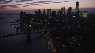 4K aerial stock footage approaching Lower Manhattan skyline, New York, New York, twilight Aerial Stock Footage | AX89_123