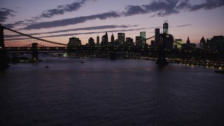 4K aerial stock footage Flying by Manhattan Bridge, Lower Manhattan skyline, New York, twilight Aerial Stock Footage | AX89_127