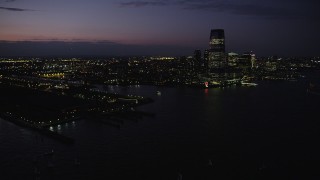 4K aerial stock footage Panning right to Goldman Sachs Tower, Downtown, Jersey City, New Jersey, twilight Aerial Stock Footage | AX89_136