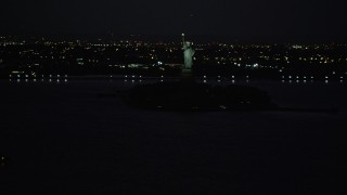 4K aerial stock footage Approaching Statue of Liberty, Liberty Island, New York, New York, night Aerial Stock Footage | AX89_144