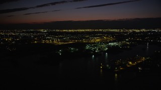 4K aerial stock footage Approaching parking garage, tilt down, Jersey City, New Jersey, night Aerial Stock Footage | AX89_149