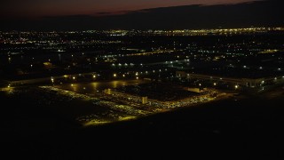 4K aerial stock footage Approaching a parking garage, tilt down, Jersey City, New Jersey, night Aerial Stock Footage | AX89_150