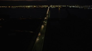 4K aerial stock footage Flying by Newark Bay Bridge, Newark, New Jersey, night Aerial Stock Footage | AX89_153