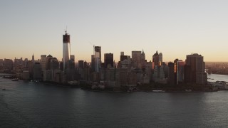 4K aerial stock footage Flying by Lower Manhattan, New York Harbor, New York, New York, sunrise Aerial Stock Footage | AX90_023