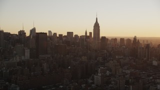 4K aerial stock footage Flying by Midtown Manhattan, Empire State Building, New York, sunrise Aerial Stock Footage | AX90_028