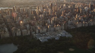 4K aerial stock footage Flying by the Metropolitan Museum of Art, New York, New York, sunrise Aerial Stock Footage | AX90_041