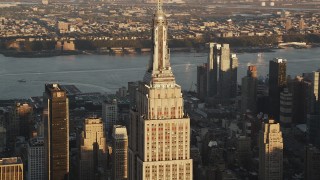 4K aerial stock footage Flying by Empire State Building, Midtown Manhattan, New York, sunrise Aerial Stock Footage | AX90_054