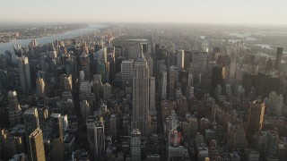 4K aerial stock footage Approaching Empire State Building, Midtown Manhattan, New York, sunrise Aerial Stock Footage | AX90_069