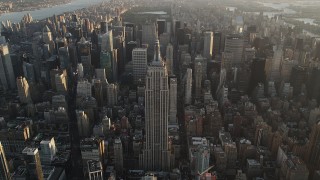 4K aerial stock footage Approaching Empire State Building, Midtown Manhattan, New York, sunrise  Aerial Stock Footage | AX90_070