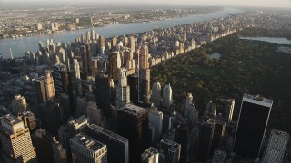 Flying by Midtown Manhattan skyscraper, New York, New York, sunrise Aerial Stock Footage | AX90_076