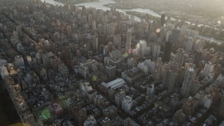 4K aerial stock footage Panning left across Upper East Side, reveal Central Park, New York, New York, sunrise Aerial Stock Footage | AX90_079