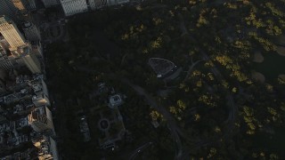 4K aerial stock footage Flying over Central Park, revealing Midtown Manhattan, New York, sunrise Aerial Stock Footage | AX90_081