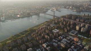 AX90_092 - 4K aerial stock footage Approaching Williamsburg Bridge, Lower East Side, New York, sunrise