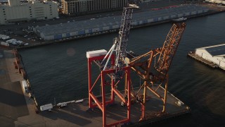 4K aerial stock footage Flying by cargo cranes, Brooklyn Cruise Terminal, Brooklyn, New York, sunrise Aerial Stock Footage | AX90_110