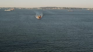 4K aerial stock footage Approaching the Staten Island Ferry on New York Harbor, New York, sunrise Aerial Stock Footage | AX90_127