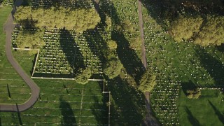 AX90_165 - 4K aerial stock footage of Bayview New York Bay Cemetery, Jersey City, New Jersey, sunrise