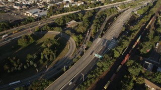 AX90_167 - 4K aerial stock footage Approaching New Jersey Turnpike Extension, Jersey City, New Jersey, sunrise