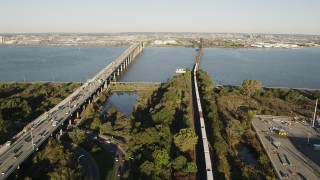 4K aerial stock footage of Lehigh Valley Railroad Bridge, Newark Bay Bridge, Newark, New Jersey, sunrise Aerial Stock Footage | AX90_168