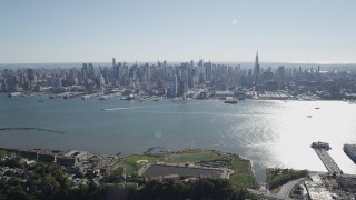 4K aerial stock footage of the Midtown Manhattan skyline and Hudson River in New York seen from Union City, New Jersey Aerial Stock Footage | AX91_004