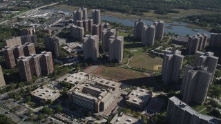 AX91_026 - 4K aerial stock footage of flying over Harry S. Truman High School and Co-op City apartment buildings, The Bronx, New York