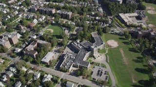 4K aerial stock footage of flying over suburban neighborhoods, Isaac E. Young Middle School, New Rochelle, New York Aerial Stock Footage | AX91_031