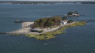 4K aerial stock footage of flying by a small island home, Island Beach, Connecticut Aerial Stock Footage | AX91_060