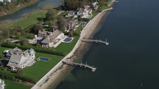 4K aerial stock footage of flying by ocean and beachfront homes with docks, Norwalk, Connecticut Aerial Stock Footage | AX91_100