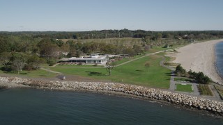 AX91_104 - 4K aerial stock footage of flying by Sherwood Island State Park and beach, Westport, Connecticut