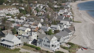 4K aerial stock footage of flying by homes on the beach in Fairfield, Connecticut Aerial Stock Footage | AX91_117