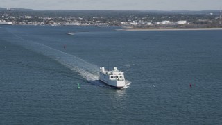 4K aerial stock footage of flying by a ferry cruising across the water, Long Island Sound, Connecticut Aerial Stock Footage | AX91_118