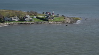 4K aerial stock footage of tilting up from the water, revealing Stratford Point Light in Stratford, Connecticut Aerial Stock Footage | AX91_122