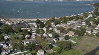 4K aerial stock footage of flying by homes near the beach and Morris Cove, New Haven, Connecticut Aerial Stock Footage | AX91_134