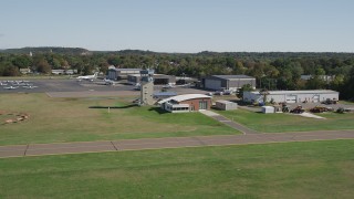 AX91_136 - 4K aerial stock footage of flying by Tweed New Haven Regional Airport control tower in New Haven, Connecticut