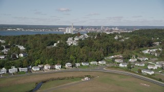 4K aerial stock footage of flying by suburban homes on a small hill in New Haven, Connecticut Aerial Stock Footage | AX91_138