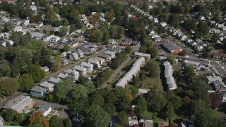 4K aerial stock footage of flying over suburban homes in autumn, New Haven, Connecticut Aerial Stock Footage | AX91_139