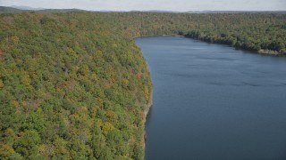 4K aerial stock footage of flying over forests in autumn and Lake Saltonstall, Connecticut Aerial Stock Footage | AX91_145