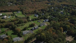 4K aerial stock footage approach neighborhoods near forests in autumn, Guilford, Connecticut Aerial Stock Footage | AX91_184